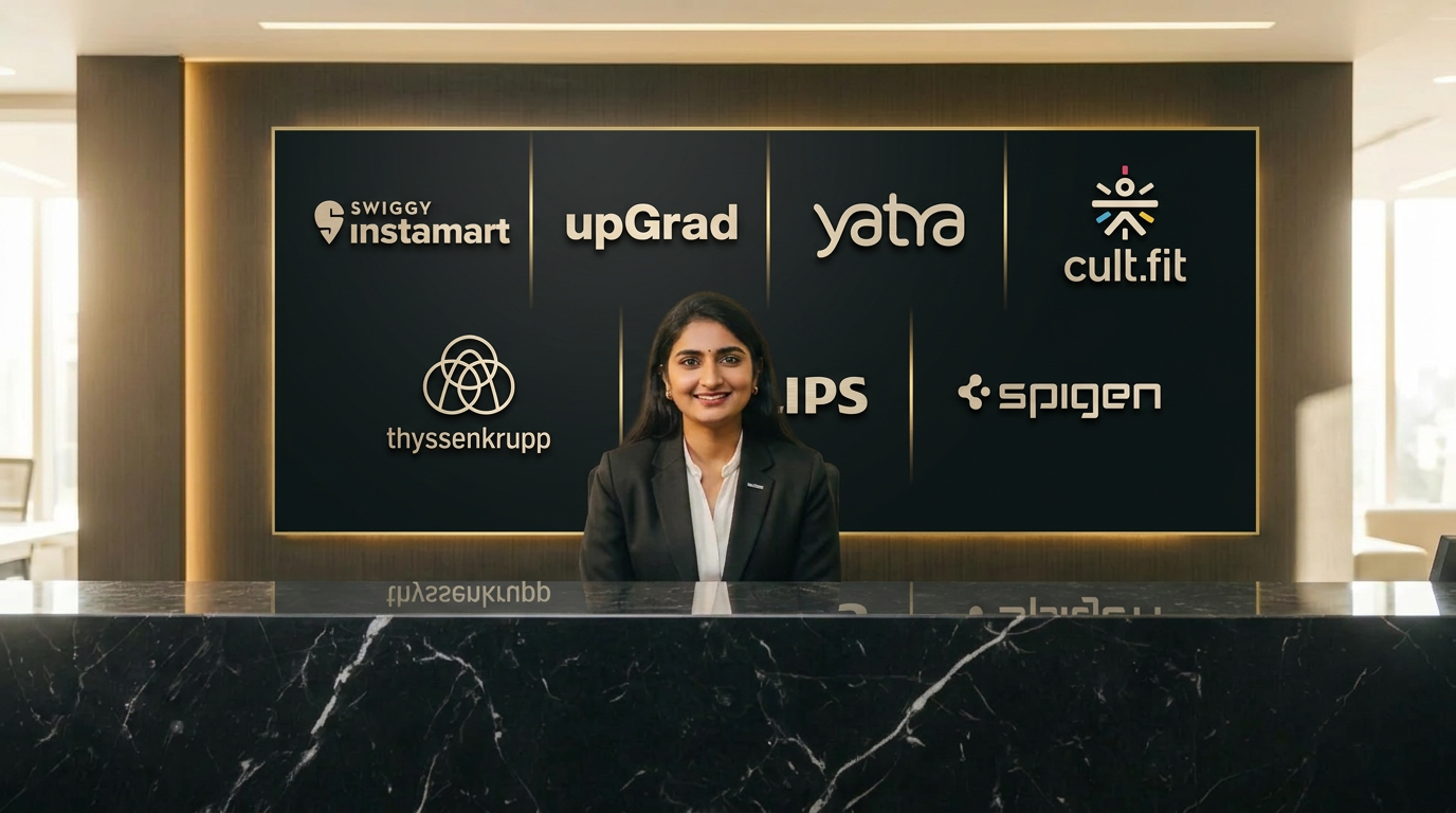 Receptionist at TBS Workspaces Bhubaneswar reception with brand signage